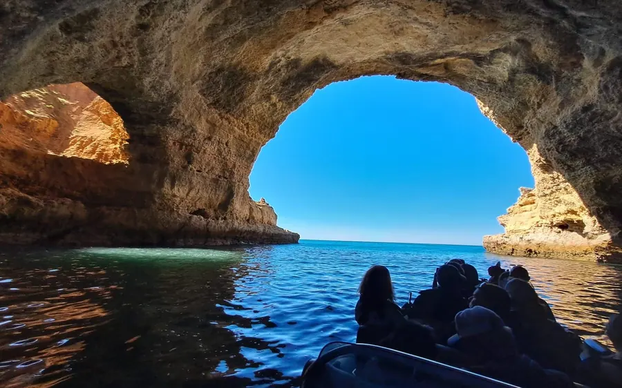 Looking out of a Benagil sea cave to open water from the boat